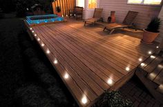 a deck lit up with candles and lights