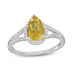 Bring cheerful color to any look when you wear this pear-shaped yellow citrine and white lab-created sapphire frame split shank ring in silver. Fashioned in sterling silver This choice glistens with a 9.0 x 6.0mm pear-shaped golden yellow citrine at the center. White lab-created sapphires line the halo frame and the ribbons of the split shank for added shimmer. Citrine is the traditional birthstone for November and is said to bring hope, health and fidelity. Yellow Pear Shaped Fine Jewelry Rings, Fine Jewelry Yellow Pear-shaped Ring, Yellow Teardrop Wedding Ring, Yellow Pear-shaped Wedding Rings, Yellow Gemstone Pear-shaped Ring, Fine Jewelry Pear-shaped Citrine, Yellow Pear-shaped Gemstone Ring, Yellow Pear-shaped Ring With Center Stone, Pear-shaped Yellow Ring For Gift