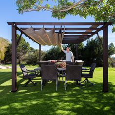 Create the outdoor space you have always dreamed of with the Modena Pergola. With its beautiful espresso frame and mocha canopy, the Modena Pergola is the perfect balance of function and style. Designed for year-round use, the Modena Pergola features a UV-protected, powder-coated aluminum frame with the appearance of wood grain. Our innovative Embedded Wood Grain™ technology provides the timeless look of wood - without the costly maintenance. And with hidden steel hardware connecting the main be Diy Carport, Pergola Carport, Building A Pergola, Pergola Design, Aluminum Pergola, Pergola Plans, Pergola Patio, Pergola Designs, Sun Exposure