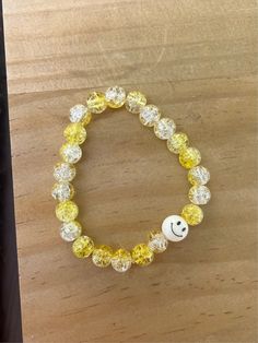 This is a larger sized bracelet, but can be made smaller for kids if needed. Glass beads are yellow and clear with a smiley bead included! Stretchy band. Yellow Beaded Bracelets With Round Beads For Everyday, Yellow Round Bead Bracelets For Everyday, Yellow Round Beads Bracelet For Everyday, Yellow Beaded Bracelets For Everyday, Fun White Plastic Jewelry, Trendy Yellow Stretch Bracelet For Everyday, Fun Yellow Bracelet With Round Beads, Fun Yellow Bracelets With Round Beads, Fun Yellow Bracelets For Everyday