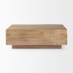 a wooden box sitting on top of a white wall