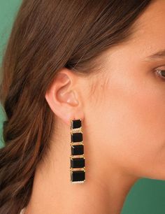 BEHIND THE DESIGN Big, bold and bright. This design showcases a cascade of gemstones light enough for you to wear comfortably throughout your day or night. The perfect statement earrings for your next special event! DETAILS Metals: 18ct Gold Plated: a thick layer of 18ct Gold over brass. Nickel-free. Stone: Natural black onyx gemstones and cubic zirconia Dimensions: 6 cm long / 2.3 inches length Weight: 10.9 grams Sold as a pair. This piece contains natural gemstones which may vary slightly in c Modern Earrings With Plating For Evening, Modern Evening Earrings With Plating, Modern Party Earrings With Plating, Modern Linear Drop Earrings For Evening, Modern Drop Earrings For Evening, Modern Long Drop Earrings For Evening, Chic Long Drop Linear Earrings For Formal Occasions, Chic Long Drop Linear Earrings For Formal Events, Chic Evening Dangle Earrings