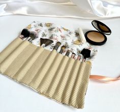 "This trendy, and useful, bee and polka dot print makeup brush roll is the perfect gift! Each roll is complete with a coordinating tie ribbon, top flap to cover brushes, and 12 various sized brush slots. Useful for holding your brushes everyday or specifically for travel. Made for makeup brushes but can be used for crochet hooks, pencils, paint brushes, and more. Made specifically to fit inside Simply Stitched Styles cosmetic bags.  Treat yourself with this makeup roll or gift this at a birthday party, bridal shower, baby shower, Christmas party, or just because! Measuring 9.5\"  x 11\" Care: - machine wash on a gentle cycle with cold water - lay flat to dry and press with an iron to remove wrinkles on a low heat setting -Check out Simply Stitched Styles other listings for matching keychai Paint Brush Roll, Crochet Hook Roll, Makeup Brush Roll, Ribbon Top, Baby Shower Christmas, Makeup Organizers, Tie Ribbon, Makeup Brush Holder, Matching Keychains