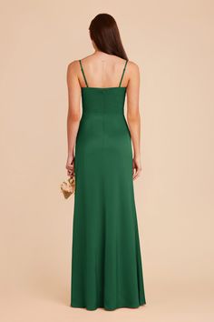 the back of a woman wearing a green dress