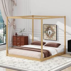 a bedroom with a four poster bed, dressers and a painting on the wall