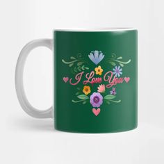 a green coffee mug with flowers and i love you written on the front in pink