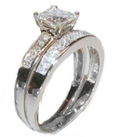 two wedding rings with princess cut diamonds on each one and side stones in the middle