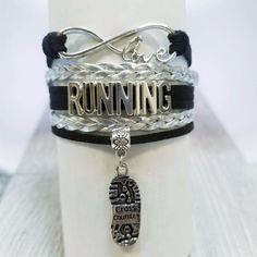 This Sportybella Girl’s Running Infinity Bracelet Is A Beautiful And Fun Way To Express Your Love Of Running. This Makes A Perfect Gift For Runners, Cross Country Teams, Track And Field Teams, Coaches. Details Of Bracelet: Running Team Colors: Silver & Black Size: Running Bracelets Are Adjustable, 5-8 Inches Adjustable Length Material: Leather And Wax Cords With Antique Silver Alloy Charms Runners Jewelry, Running Bracelet, Coaches Gifts, Xc Running, Running Jewelry, Running Gift, Sports Attire, Jewelry Cross, Country Jewelry