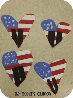 three heart shaped cut outs with the american flag painted on them