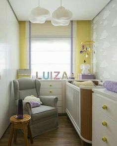 a baby's room with yellow walls and white furniture