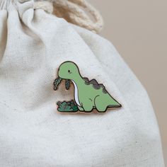 Who can resist that cute face? Not even the fussiest of eaters will be able to turn down their veggies when they see this adorable Bronti enamel pin. It's the perfect way to show your love for all things green! Size: 1.2" x 1.6" Green Enamel Pin Brooch For Gift, Green Enamel Brooch Pin As Gift, Green Brooch Enamel Pin For Gift, Green Enamel Brooch As Gift, Cute Enamel Pin For Gifts, Green Enamel Pins, All Things Green, Animal Pins, Enamel Pin Collection