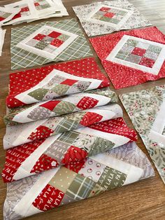 the quilts are laid out on the floor to be sewn together for christmas