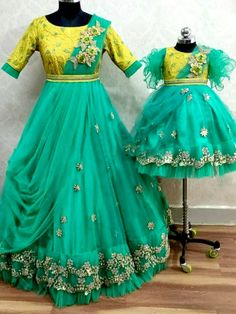 Green And Yellow Net Mother Daughter Matching Combo Dress in Floral Handwork Brocade Anarkali Dress For Reception, Fitted Brocade Dresses For Reception, Traditional Brocade Dresses, Traditional Brocade Dresses For Reception, Brocade Dress For Reception With Traditional Drape, Anarkali Dress With Dori Work For Traditional Ceremonies, Designer Brocade Dress With Traditional Drape, Floor-length Brocade Dress With Intricate Embroidery, Designer Brocade Floor-length Dress