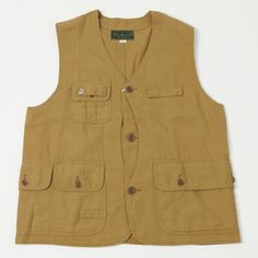 Cut from a rugged cotton twill fabric with sulfur dye, this traditional fishing vest takes its influence from a mid-20th Century piece from the Warehouse & Co archives. With utility at its core, this boxy fit design offers multiple pockets to safely stow away your valuables, and features period correct nut buttons for added heritage charm. To finish the design off, Warehouse have added one of their beautiful custom woven brand labels to the neck. Vintage/boxy fit Mid-century inspired Traditional fishing vest 100% cotton drill Sulfur dyed fabric Multiple utility pockets Custom woven brand label Traditional nut buttons Made in Japan Workwear Boots, Denim Repair, Moc Toe Boots, Fishing Vest, Mountaineering Boots, Plain White Tee, Wing Shoes, Red Wing Shoes, Vintage Sneakers