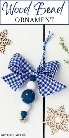 Blue and white wood bead ornaments on a white table Wood Bead Wreath Ornament Diy, Christmas Ornaments Made With Wooden Beads, Beaded Christmas Decorations Diy, Wood Bead Crafts Diy, Diy Christmas Ornaments Gifts, Crafts With Wooden Beads