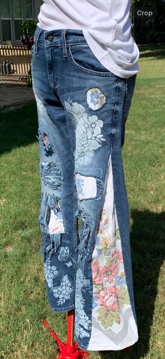 Romantic Upcycled Denizen Levi's 208 taper jeans with vintage tablecloth gusset insert for wide leg comfort. Front pockets customized to fit iPhone 15/larger phones and other essentials. Deep pockets keep items intact. Back pockets painted with white roses.  Waist 28, Length 30. Truly one of a kind. Distressed, patched, and appliques made from vintage table cloth flowers,  machine embroidery adds charm, texture and durability.  9" rise, 4" zipper, 31" inseam. 22" round bell bottom. All year roun Distressed Bottoms For Spring Festival, Bohemian Straight Leg Summer Jeans, Bohemian Straight Leg Jeans For Summer, Bohemian Relaxed Fit Jeans, Spring Bohemian Jeans, Bohemian Denim Bottoms With Floral Print, Bohemian Spring Bottoms With Floral Patchwork, Spring Bohemian Bottoms With Floral Patchwork, Bohemian Distressed Summer Jeans