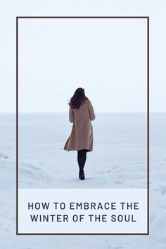 a woman walking in the snow with text overlay that reads how to embrace the winter of the soul