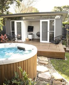 a hot tub sitting in the middle of a yard