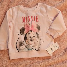 Nwt Light Pink Minnie Sweatshirt. Never Worn. Cute Minnie Mouse Tops For Fall, Cute Long Sleeve Minnie Mouse T-shirt, Cute Minnie Mouse Long Sleeve T-shirt, Playful Long Sleeve Minnie Mouse Top, Pink Long Sleeve Minnie Mouse Top, Cotton Minnie Mouse Top For Playtime, Jack Skellington Hoodie, Mickey Hoodie, Minnie Mouse Hoodie