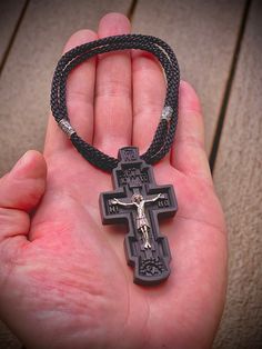 Dimensions: 2.5 inch x 1.3 inch (0.5 inch thick) This eight-pointed pectoral Orthodox cross of the classical form is carved from ebony, with the jeweler's precision according to all Orthodox canons. The value of ebony is not only in its unusual color, but also in its strength. Treated with natural oil, which protects it against moisture and perfectly shows the structure of the tree. The crucifixion of the Savior is made of premium 925 Sterling Silver. This cross is anti-allergic and made to last The Crucifixion, Orthodox Cross, Jesus Prayer, The Savior, St Nicholas, Wooden Cross, Natural Oil, Christian Jewelry, Silver Accents