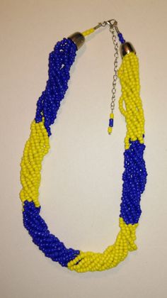 "This jewellery set is made of multiple strands of alternating blue and yellow glass beads. The necklace is 20\" long and can be extended by 3\"and the bracelet is made from seven rounds of memory wire." Adjustable Yellow Multi-strand Beaded Necklace, Blue Jewelry Set, Blue Beaded Bracelets, Yellow Necklace, Yellow Jewelry, Blue Accessories, Beads Jewellery, Multi Strand Bracelet, Anniversary Jewelry