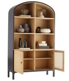 a bookcase with shelves and vases on it