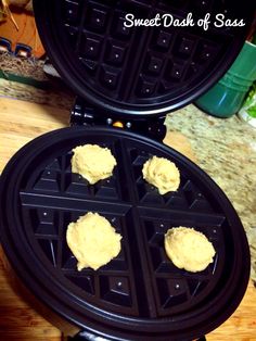 two waffles with peanut butter on them sitting on a table