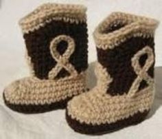 a pair of crocheted boots with an amp symbol on them