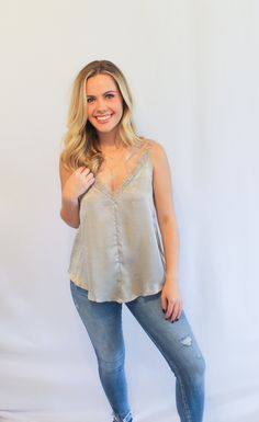 A perfect silky tank to layer to dress up any outfit this winter. Fabric: 100% Polyester Front and back v-neck Adjustable shoulder straps V-neck Top With Adjustable Straps For Night Out, V-neck Camisole With Built-in Bra For Night Out, V-neck Tank Top With Built-in Bra For Layering, Chic V-neck Tank Top With Adjustable Straps, V-neck Camisole With Delicate Straps For Night Out, Trendy V-neck Top With Adjustable Straps, V-neck Tank Top With Delicate Straps For Night Out, V-neck Top With Delicate Straps For Night Out, V-neck Tops With Delicate Straps For Night Out