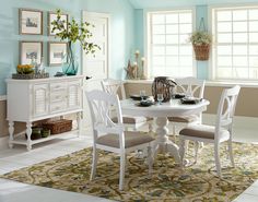 a white table and chairs in a room