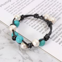 -Product Description: Material: pearl, leather, turquoise Length: option -Packaging: Each Item is well packed in cloth bag, ready to give away as gift. This minimalist bracelet is lightweight and comfortable to wear. Perfect for everyday! The size and shape and color of the pearl may slightly vary due to natures shape. As this item is handmade, please allow for small variations in design. If you need warehouse, please contact us, we will give you the best price, the best quality, the most trendy Adjustable Turquoise Bohemian Pearl Bracelet, Adjustable Blue Bohemian Pearl Bracelet, Adjustable Bohemian Blue Pearl Bracelet, Handmade Adjustable Turquoise Pearl Bracelet, Pearl Beaded Bracelet, Red Jasper Stone, Knit Bracelet, Boho Handmade, African Turquoise