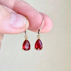 Garnet Earrings, January Birthstone, Tiny Dark Red Teardrop Earrings in Gold or Silver, Pear Shape Drop Earrings, Garnet Jewelry for Women These elegant minimal tiny earrings feature dark red Garnet teardrop gemstones prong set in your choice of gold filled or sterling silver. The vivid garnet pear cut drops are suspended from lever back ear wires in the finish of your choice. These are great choice for small, delicate and simple yet elegant earrings to wear virtually anywhere. Ideal gift for a Red Drop Crystal Earrings As Gift, Red Teardrop Crystal Earrings, Red Ruby Drop Earrings, Red Drop Earrings For Gift, Red Pear-shaped Earrings For Gift, Red Ruby Pear-shaped Earrings, Red Teardrop Earrings As A Gift, Teardrop Crystal Earrings With Lever Back As Gift, Gift Pear-shaped Teardrop Earrings