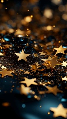 some gold stars on a black and blue background