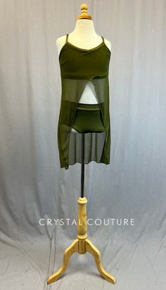 Custom Olive Green camisole bra top has attached mesh overlay that opens in front. Paired with matching lycra trunks. Custom made by The Line Up! **Costume in image is an AXS, Photographed on an AXS/AS Mannequin with Measurements of: Bust 30", Waist 25", Hip 31", Girth 52" Fitted Sheer Mesh Tank Top, Sheer Fitted Mesh Tank Top, Sheer Stretch Mesh Camisole Top, Green Stretch Sheer Mesh Top, Green Sheer Stretch Mesh Top, Stretch Dancewear Crop Top For Summer, Stretch Summer Dancewear Crop Top, Summer Stretch Dancewear Crop Top, Stretch Crop Top For Summer Dancewear