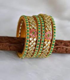 High Quality Stylish Floral look Bangles set for Women, Kadaas can be used individually. All bangles are wrapped with colored silk thread. Outer kadaas have golden work beads on top. our can wear on all Functions, Weddings, Indo-western Ethnic wear and Party wear dresses or Festivals. Keep them away from water and other liquids, No direct Perfumes, deos, water, spray to make it durable. Green Zari Work Bangle Bracelet, Multicolor Wedding Bangle With Motifs, Ceremonial Multicolor Zari Work Jewelry, Adjustable Kundan Jewelry With Zari Work, Green Bangle With Zari Work, Multicolor Motif Bangle Jewelry, Traditional Green Bracelets With Zari Work, Multicolor Motifs Bangle Jewelry, Traditional Green Bangle With Zari Work