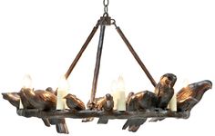 a chandelier with five lit candles hanging from it's center and birds on the bottom