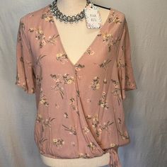 This Beautiful Pink Rose Women's Blouse Is Perfect For Any Occasion. The V-Neckline And Short Sleeves Provide A Comfortable And Stylish Fit For All Body Types. The Blouse Is Made Of High-Quality Rayon Material That Is Both Soft And Durable. The Pink Color And Rose Theme Add A Touch Of Femininity To Any Outfit. This Blouse Is Available In A Regular Size L And Is Perfect For Any Woman Looking To Add A Basic, Yet Stylish Piece To Her Wardrobe. Feminine Rose Print Tops For Spring, Feminine Rose Print Blouse, Feminine Rose Print Summer Blouse, Chic Rose Print Top For Day Out, Feminine Short Sleeve Top With Rose Print, Rose Print Tops For Day Out, Pink V-neck Top For Spring, Chic Pink V-neck Top For Spring, Feminine Pink V-neck Blouse