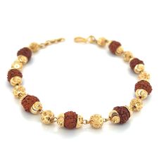 Purity Info will be here 22K Yellow Gold Stone Info will be here Rudraksha Weight 11.41 Gm Dimension: 8.5in L Product detail: Product Code: BRAC-2301283 Color: Yellow Gold Product Type: Bracelet Age Group: Adult Gender: Unisex Availability: In Stock Country Of Origin: India Product description: 22k gold rudkraksha bracelet. Bracelet features gold beads measuring 6mm in thickness and gold capped rudraksha beads measuring 8mm in thickness. Bracelet length is 8.5 inches in length with adjustable ju Rudraksha Bracelet, Rudraksha Beads, Black Beaded Bracelets, Gold Caps, Gold Earrings Dangle, 22k Gold, Black Beads, Gold Beads, Shop Earrings