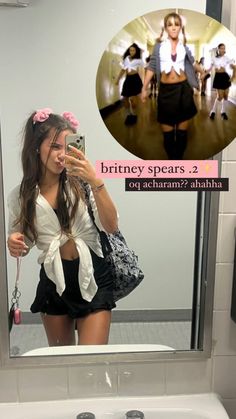 a woman taking a selfie in front of a bathroom mirror with the caption, briney spears 2 od acham?? ahha?????????????