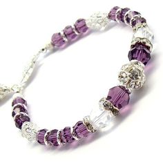 "Perfect for your wedding or common wear. I used faceted round Amethyst and Clear Premium Quality Crystal(8mm,6mm) and delicate silver plated round rhinestones spacer beads with clear crystals beads.  The bracelet is finished with filigree silver plated box clasp. All metal components are silver plated. The bracelet measures 7 1/2\" including box clasp and can be re-sized before shipping. Ordering bracelets is much easier if you know your correct wrist size. When you order a bracelet from me, I want it to fit you perfectly ! To determine your wrist size: Measure your wrist with a flexible tape measurements below the wrist bone, where you would normally wear your bracelet. That would be your wrist size, now add 1\". This is approximate size of your bracelet. Please give me size of your wris Bridesmaids Purple, Blue Jewelry Set, Crystals Beads, Swarovski Crystal Bracelet, Swarovski Bracelet, Purple Jewelry, Casual Jewelry, Bohemian Bracelets, Wedding Jewelry Bracelets