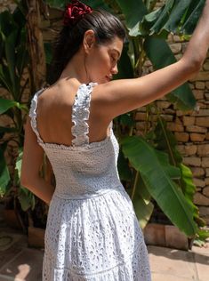 The Kristen Dress brings a fresh twist to effortless style with an airy, partially lined silhouette in embroidered cotton eyelet. Its tiered midi design flows beautifully, with a lining that stops at the knee, leaving the hem sheer for a touch of softness and sophistication. Just slip it on, and you’re instantly ready for everything from beachside brunches to evening strolls. Featuring a smocked bodice and straps, this dress is as comfortable as it is striking. The lace-trimmed tiers and flounce White Floral Eyelet Dress, Lace Midi Dress With Ruffles For Vacation, Sleeveless Midi Dress With Broderie Anglaise For Vacation, Vacation Lace Midi Dress With Ruffles, White Spring Dress With Cutwork Hem, Elegant Tiered Smocked Dress For Garden Party, Casual Tiered Broderie Anglaise Dresses, Summer Dresses With Broderie Anglaise And Tiered Skirt, Tiered Broderie Anglaise Dress For Daywear