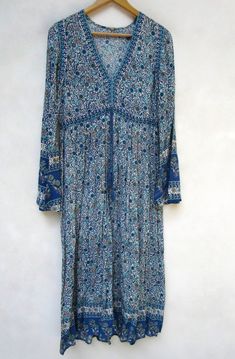 "ITEM DESCRIPTION women rayon maxi dress- with tassels floral print dress-full bell sleeve casual wear dress-long maxi style indian traditional dress Features : Long sleeve, V neck, Long dress Material : rayon crepe Fabric: 100% rayon soft light weight ethnic print fabrics Sleeve Length = 24inch For more sizes & their measurement, please refer our below chart to understand the sizes variations available with us For your size requirement, please mention your size in seller note at the time of Blue Printed Long Maxi Dress, Blue Long Sleeve Printed Maxi Dress, Blue Printed Hippie Dresses, Blue Hippie Printed Dresses, Hippie Blue Printed Dresses, Floral Print Flowy Maxi Dress With Bell Sleeves, Blue Bohemian Maxi Boho Dress, Blue Bohemian Maxi Dress For Fall, Flowy Bell Sleeve Maxi Dress With Floral Print