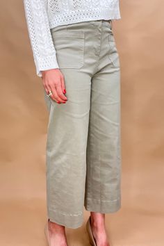 Introducing the luxurious Valeria Pant, a wide leg, cropped chino pant in a soft sage green. With intricate front and back pocket detailing and a button front, this pant exudes sophistication and exclusivity. Elevate your wardrobe and make a statement with this elegant and tasteful piece. Fit: true to size, 26” inseam Soft Sage Green, Cropped Chinos, Pants Large, Ethical Fashion, Pocket Detail, Chinos Pants, Sage Green, Sweater Top, Wide Leg