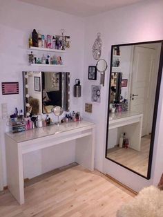 there is a vanity and mirror in the room