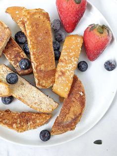 french toast with blueberries and strawberries on a plate