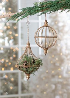 two ornaments hanging from a christmas tree