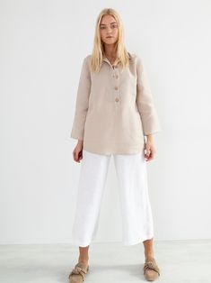 "LARA is a tunic style linen pullover shirt with long sleeves. DETAILS - Tunic style design - Long Sleeves - Collared - 100% midweight European linen fabric - Cut and sewn to order just for you in our studio COLOR - Beige, you can also choose other colors above - Fabric samples are available here https://www.etsy.com/listing/586569696/linen-fabric-samples SIZING & FIT - Length (shoulder to hem) is approximately 28 inches / 71 cm - Bust (pit to pit) is approximately 19 inches / 48 cm - Waist Neutral Relaxed Fit Long Sleeve Blouse, Long Sleeve Linen Tops For Daywear, Relaxed Fit Long Sleeve Blouse In Flax Color, Flax Long Sleeve Relaxed Fit Blouse, Flax Colored Long Sleeve Relaxed Fit Blouse, Beige Linen Long Sleeve Top, Long Sleeve Beige Linen Top, Relaxed Fit Long Sleeve Flax Blouse, Long Sleeve Tunic With Buttons For Work