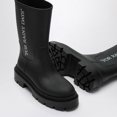 Hey there. Need something to keep your feet dry while splashing around in the rain? These black rubber beauties are just the thing, blending style with practicality effortlessly. Crafted from 100% rubber with a durable rubber sole Features iconic Off-White writing on the side Classic rounded toe for a comfortable fit Perfect for any wet weather adventure Off White Mens, White Boots, Wet Weather, Louis Vuitton Shoulder Bag, Men's Boots, Black Rubber, On The Side, Rainy Days, Boots Men