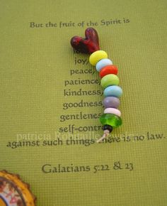 a colorful beaded necklace with words on it