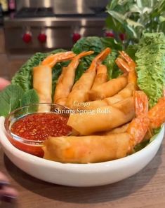 shrimp sticks with ketchup and lettuce in a bowl on a table